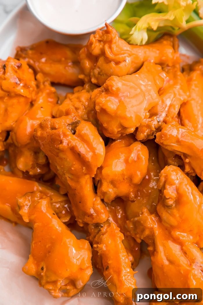 Crockpot chicken wings served with dipping sauce