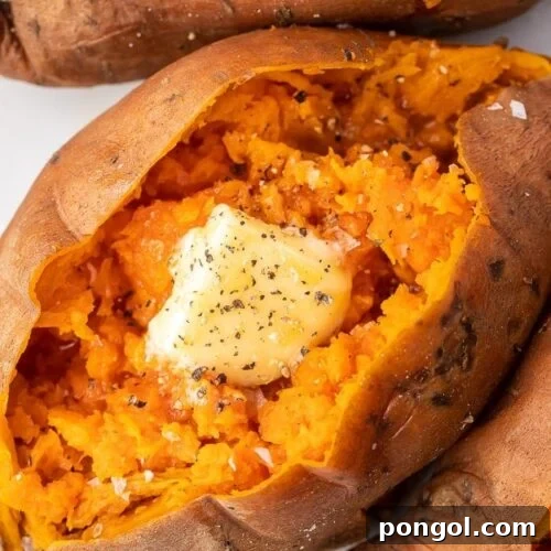 Close up of a fluffy Instant Pot sweet potato with melting butter, indicating its perfect tenderness.