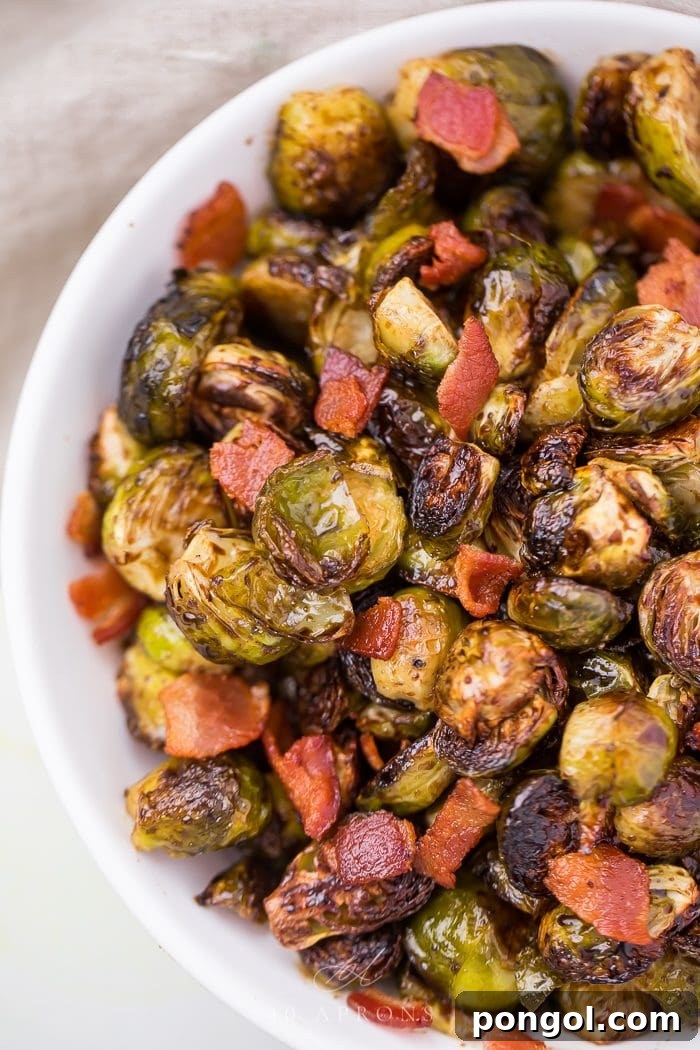 Crispy balsamic Brussels sprouts with bacon in a elegant serving dish, ready to be enjoyed.