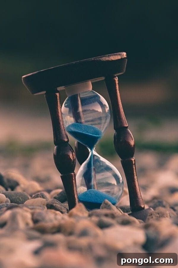 An hourglass with blue sand, symbolizing the passage of time required for adaptogens to show their full effects.