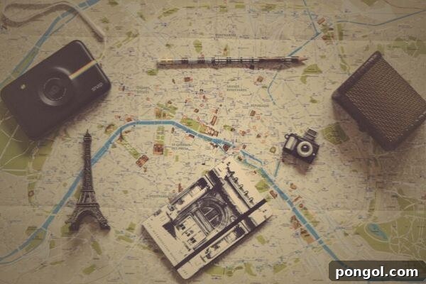 A flat lay showing a travel journal, a pen, and a vintage-style camera resting on an open city map, inspiring thoughts of adventure and thoughtful planning.