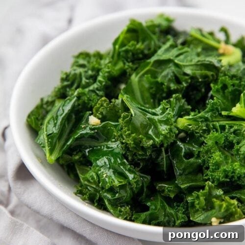 Sauteed kale served in a white bowl