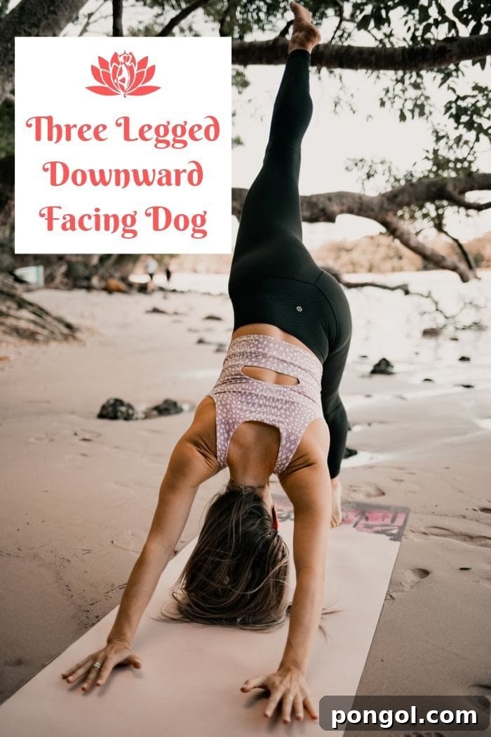 Effortless Detox: 8 Yoga Poses to Cleanse Your System 4 a woman holding the yoga position three legged downward facing dog on a beach