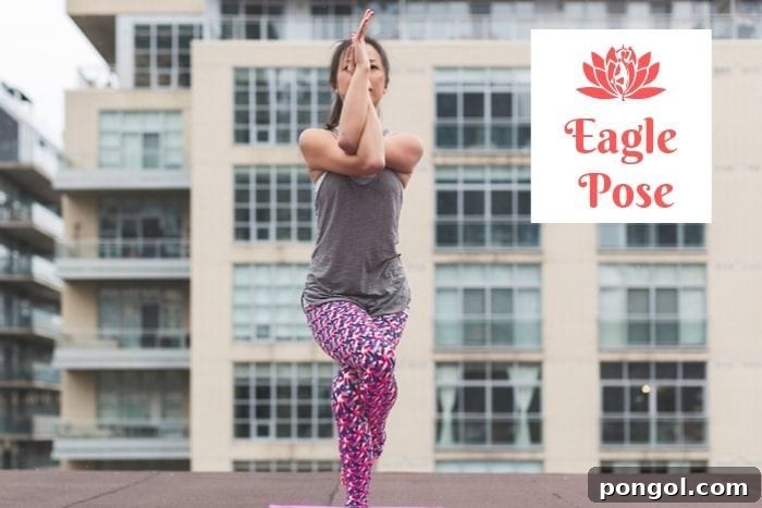 Effortless Detox: 8 Yoga Poses to Cleanse Your System 5 a woman holding the eagle yoga position in front of an apartment building