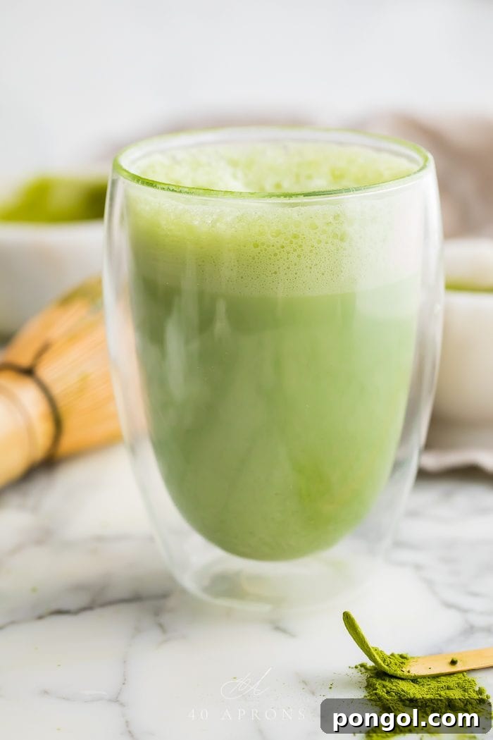 Matcha latte in a double walled glass
