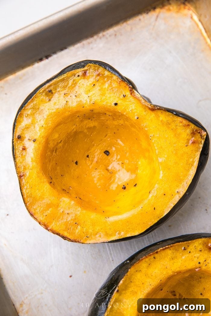 Close-up of a perfectly baked acorn squash half, ready for serving