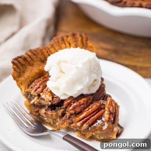 A slice of paleo pecan pie with whipped cream