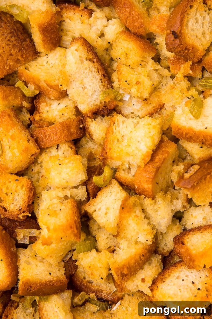 Close-up view of golden gluten-free stuffing, showing its inviting texture and crispy edges