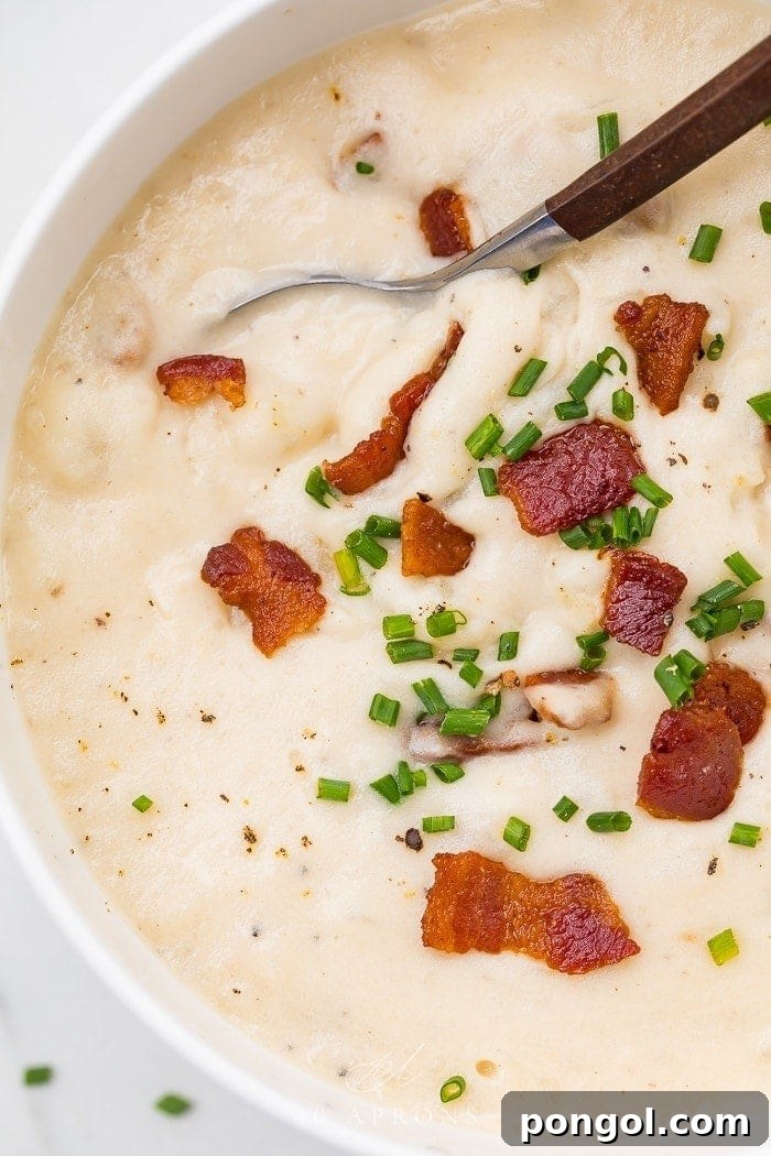 Whole30 potato soup up close with bacon and chives