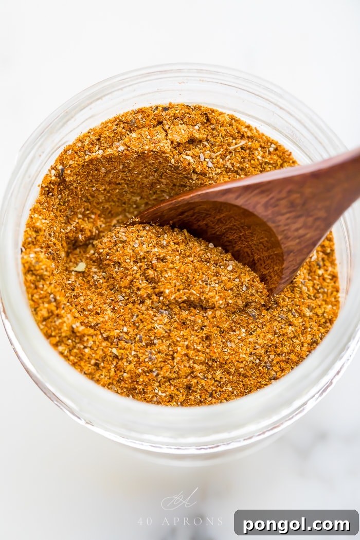 A small wooden spoon in the spice mix
