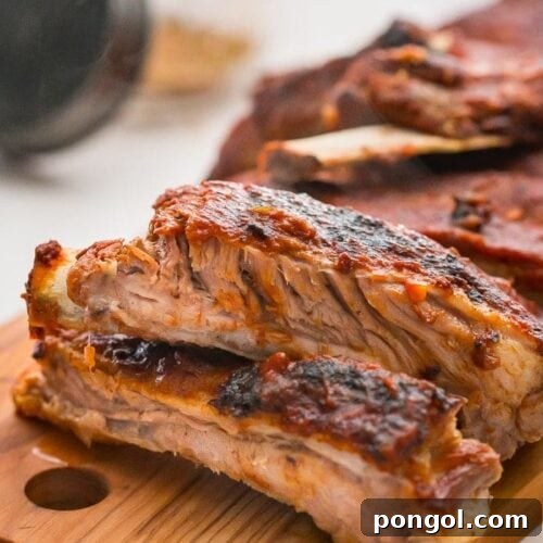 Close up of baby back ribs on a chopping board