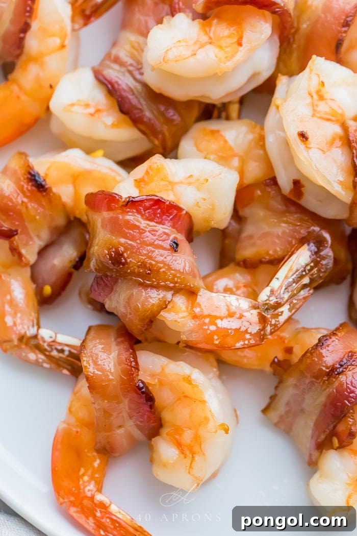 Crispy Bacon Shrimp Bites 4 Close up of perfectly cooked bacon wrapped shrimp with glaze
