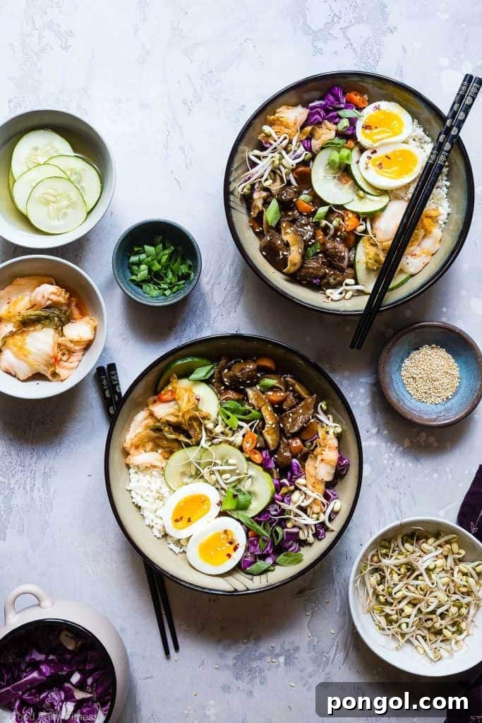 A vibrant serving of Slow Cooker Whole30 Paleo Korean Beef Stew, presented in a bowl with chopsticks, highlighting its rich color and inviting texture.