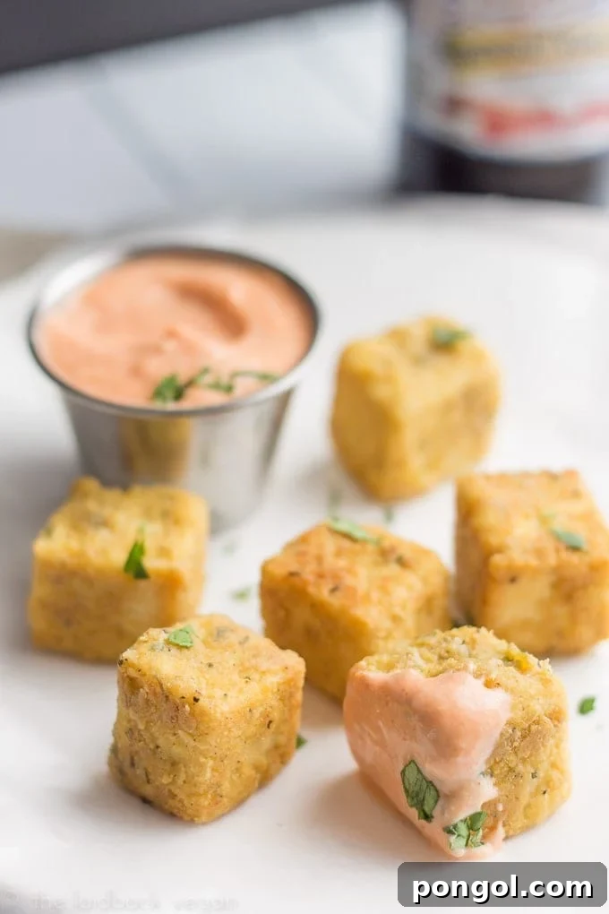 Crispy Tofu "Chicken" Nuggets with Sriracha Mayo 4 Tofu Chicken Nuggets ready for dipping in Sriracha Mayo