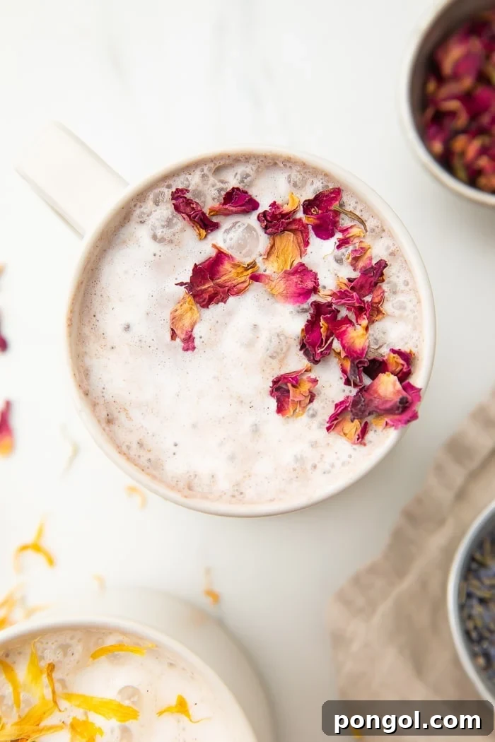 Cherry moon milk in a white mug, with a vibrant red hue.