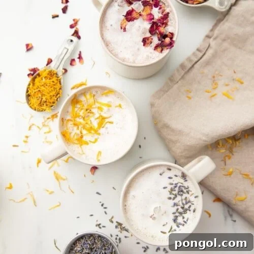 Three versions of moon milk in white mugs