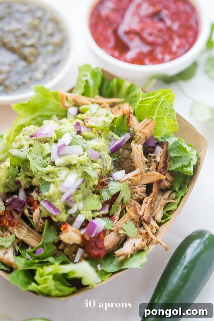 Flavorful Whole30 Dinner Ideas 25 Chipotle copycat carnitas bowls, artfully arranged and ready to eat.
