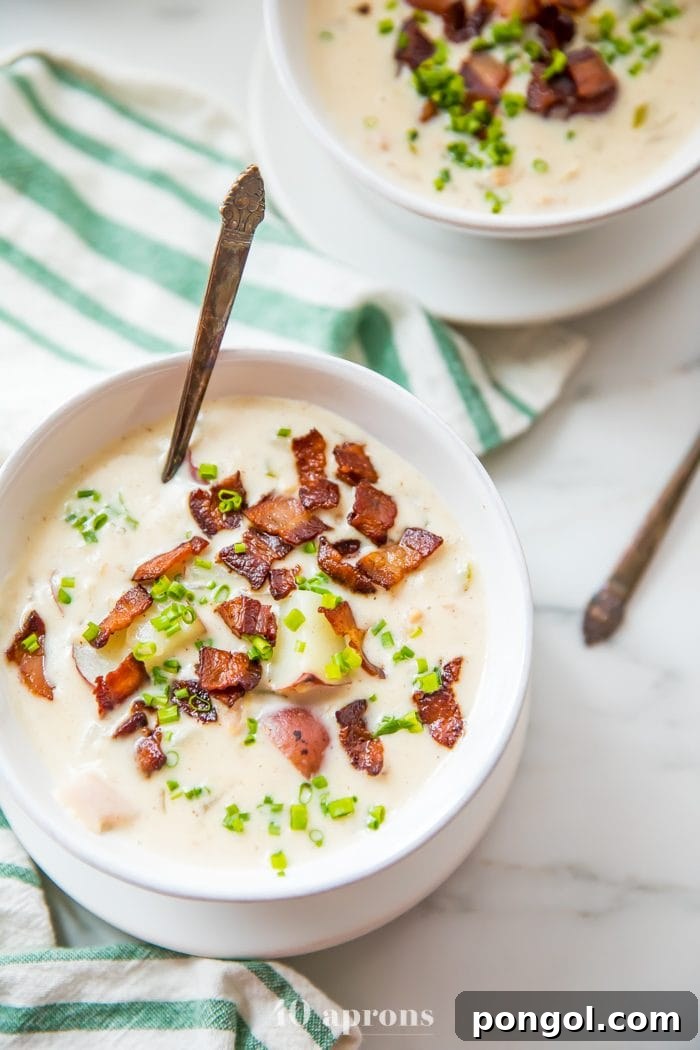 Flavorful Whole30 Dinner Ideas 36 Healthy clam chowder in a white bowl, rich and creamy.