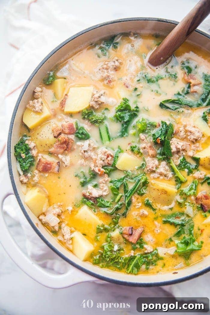 Flavorful Whole30 Dinner Ideas 46 A large pot of Whole30 healthy zuppa toscana recipe, steaming and ready to serve.