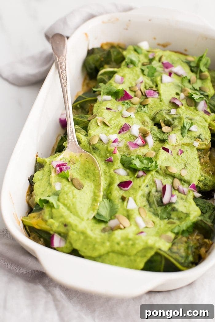Flavorful Whole30 Dinner Ideas 32 Whole30 poblano pork enchiladas, topped with a creamy avocado-cilantro sauce.