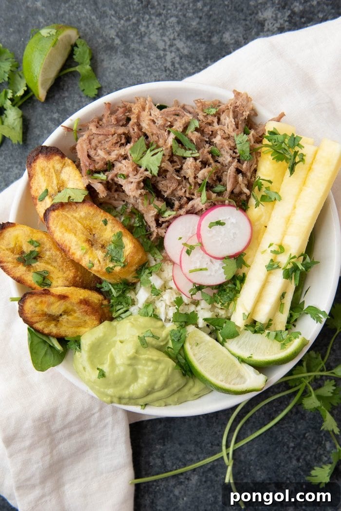 Flavorful Whole30 Dinner Ideas 33 Whole30 pork and pineapple bowl with plantains, coconut cauliflower rice, and avocado lime mousse.