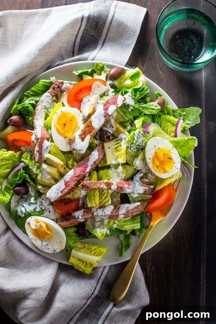 Flavorful Whole30 Dinner Ideas 34 Whole30 steak salad steakhouse style, piled high with fresh ingredients.