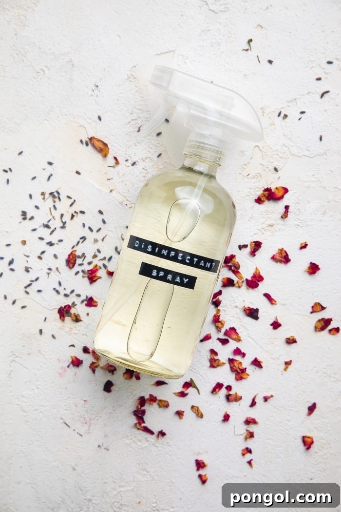 A bottle of DIY Lysol spray on dried flowers