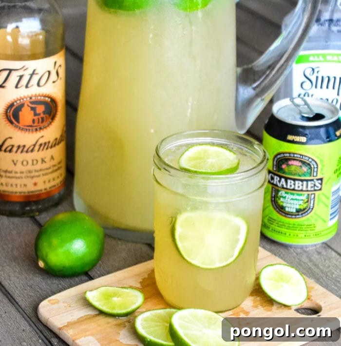 A beautifully garnished glass of Perfect Cinnamon Apple Cider Mimosa, featuring a cinnamon stick and a delicate apple slice, ready for a fall brunch.