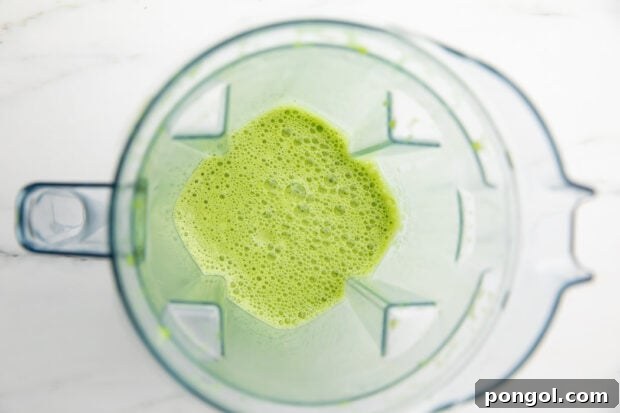 Blended iced matcha latte in a blender