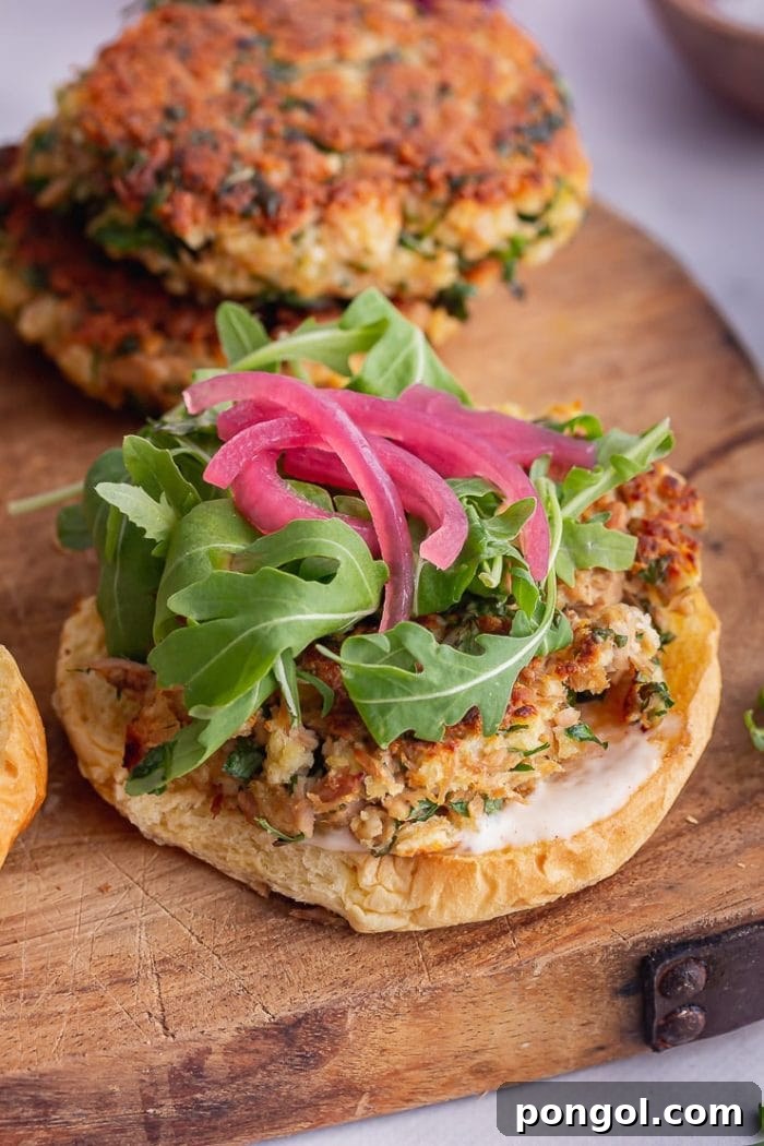 Delicious Tuna Burgers with Smoked Paprika Mayo on toasted buns with fresh greens.