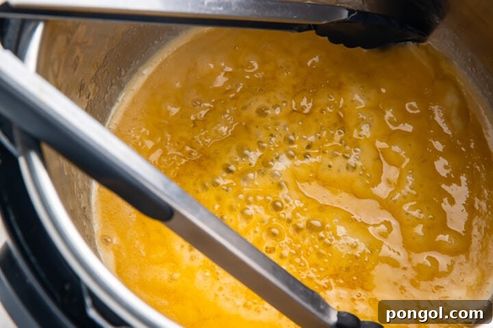 Instant Pot Honey Butter Corn Perfection 8 Melted honey butter in the Instant Pot.