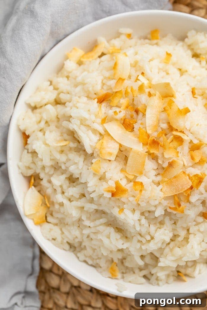 Bowl of perfectly cooked coconut rice, ready to be served