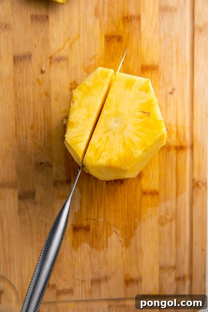 Unlock the Secret to Easy Pineapple Slicing 5 Cutting around the central core of a pineapple