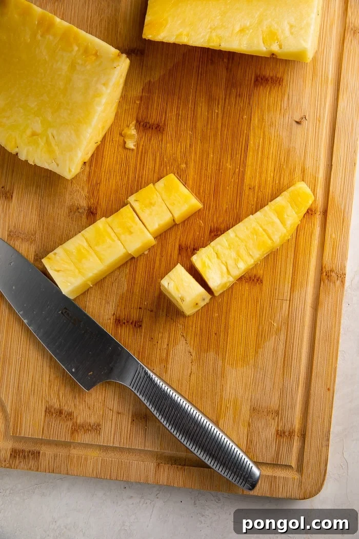 Unlock the Secret to Easy Pineapple Slicing 10 Bowl of perfectly diced pineapple cubes, ready to enjoy