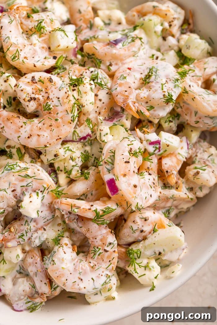 Close-up of creamy shrimp salad with generous chunks of shrimp