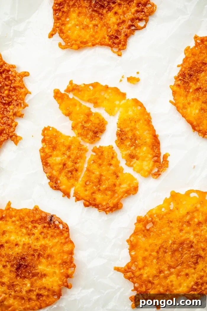 Cheesy Keto Crisps 4 Close-up of baked cheddar cheese crisps with a golden edge