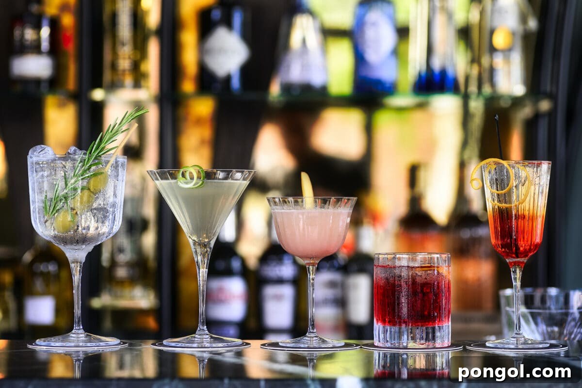 Finding My Light: A Natural Triumph Over Depression 4 Five beautifully prepared cocktails resting on a sleek bar top, set against a backdrop of neatly arranged alcohol bottles, evoking a sense of refined taste and choice.