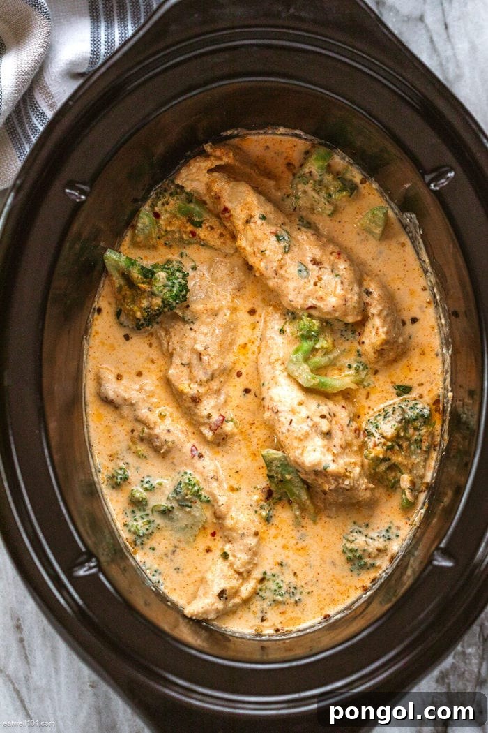 Hearty Crock-Pot Low Carb Keto Taco Casserole with melted cheese, ground beef, and colorful toppings.