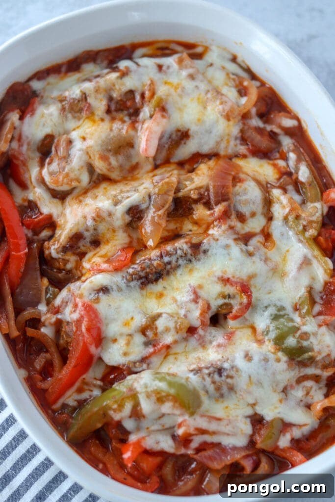 Creamy Crockpot Loaded Cauliflower Casserole topped with melted cheese and crispy bacon.