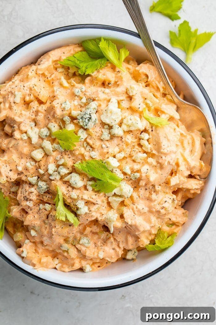 A generous serving of Buffalo Chicken Salad in a bowl, ready to be enjoyed as a meal or dip.