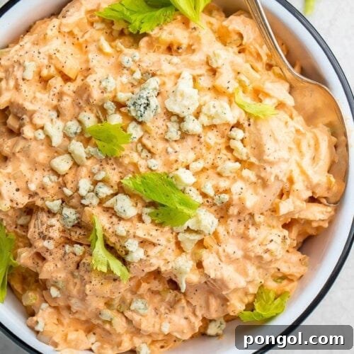 Prepared Buffalo Chicken Salad ready to be served, highlighting its appealing texture.