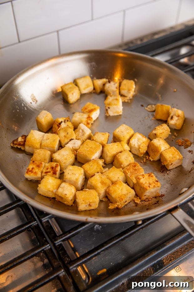 Pan-frying tofu in a skillet