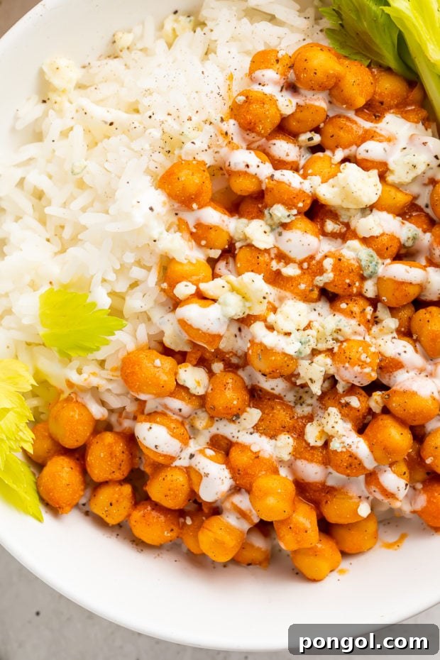 Fired Up Buffalo Chickpea Bowl 8 Finished buffalo chickpeas in a skillet, coated in creamy buffalo sauce.