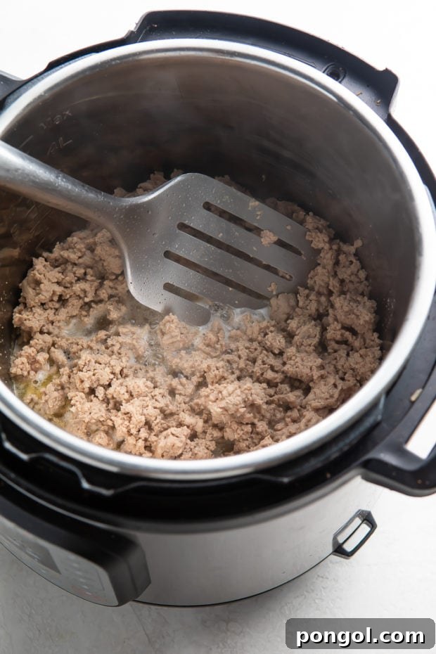 Ultimate Instant Pot Turkey Chili 6 Browning ground turkey in Instant Pot for chili