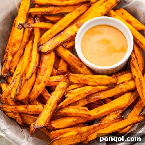 A bowl of homemade air fryer sweet potato fries on a table.