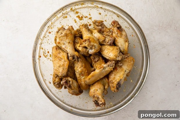 Tossing wings in sauce