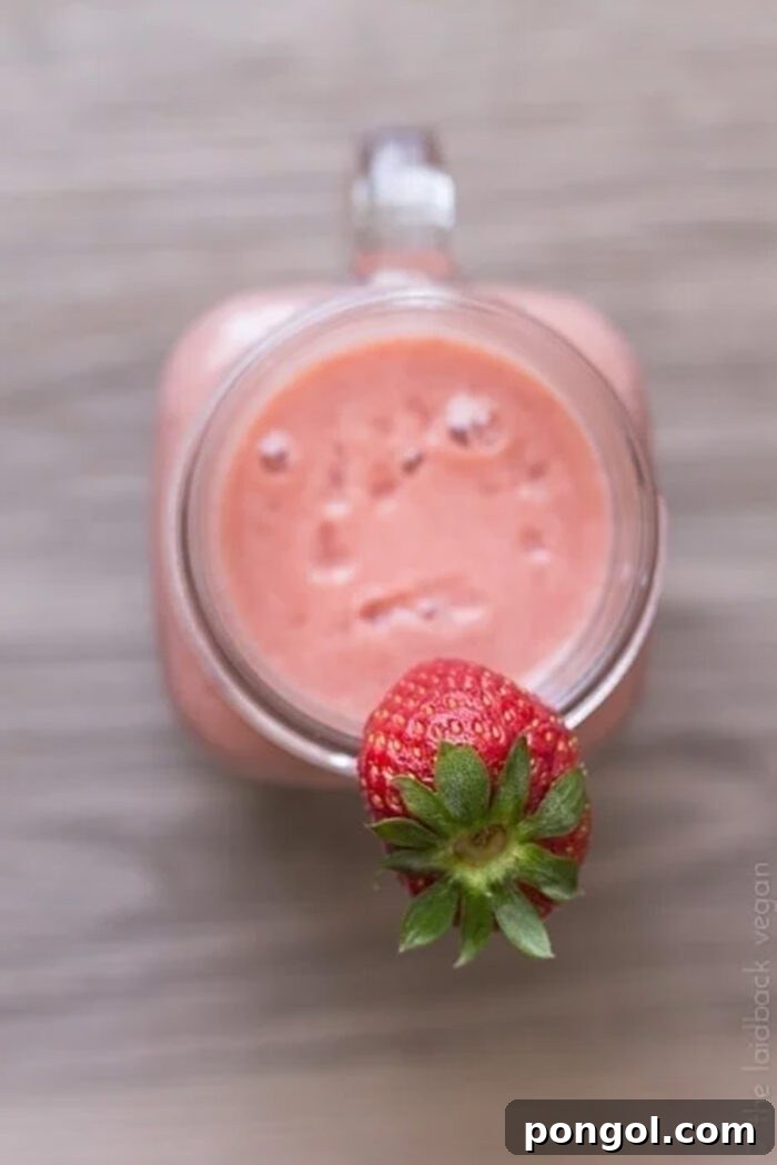 Flat tummy strawberry kombucha smoothie, overhead.