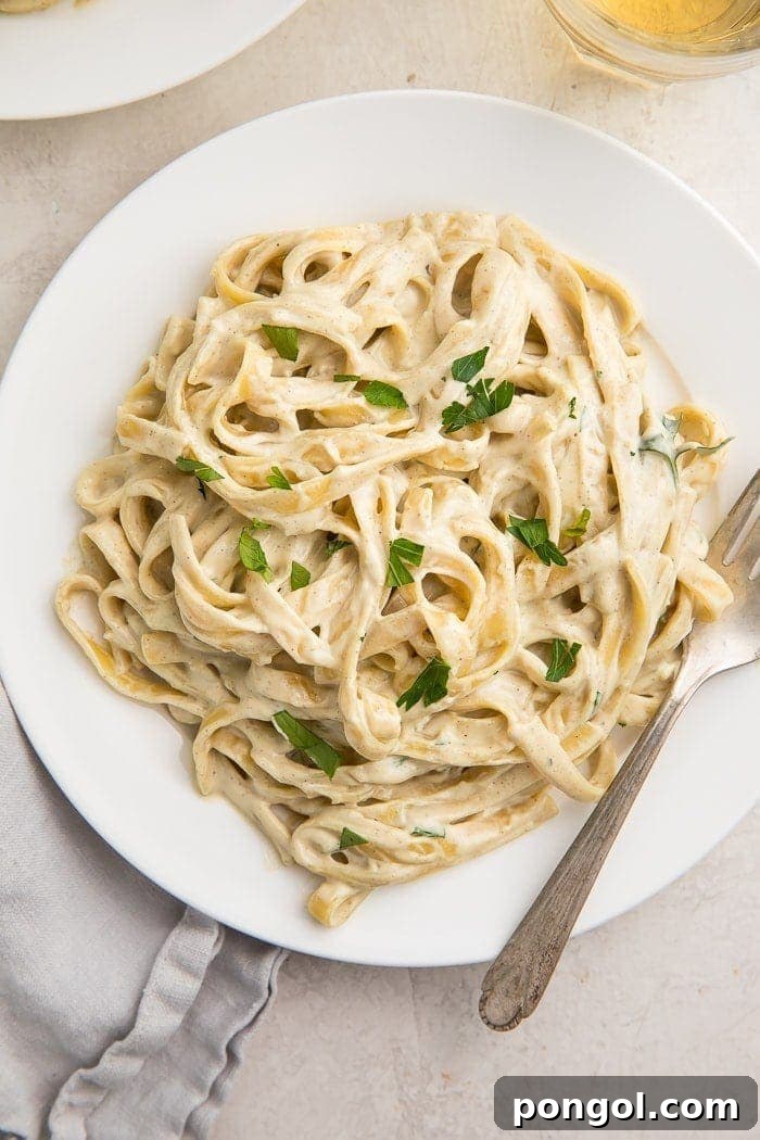 Overhead of pasta with vegan alfredo sauce on a plate