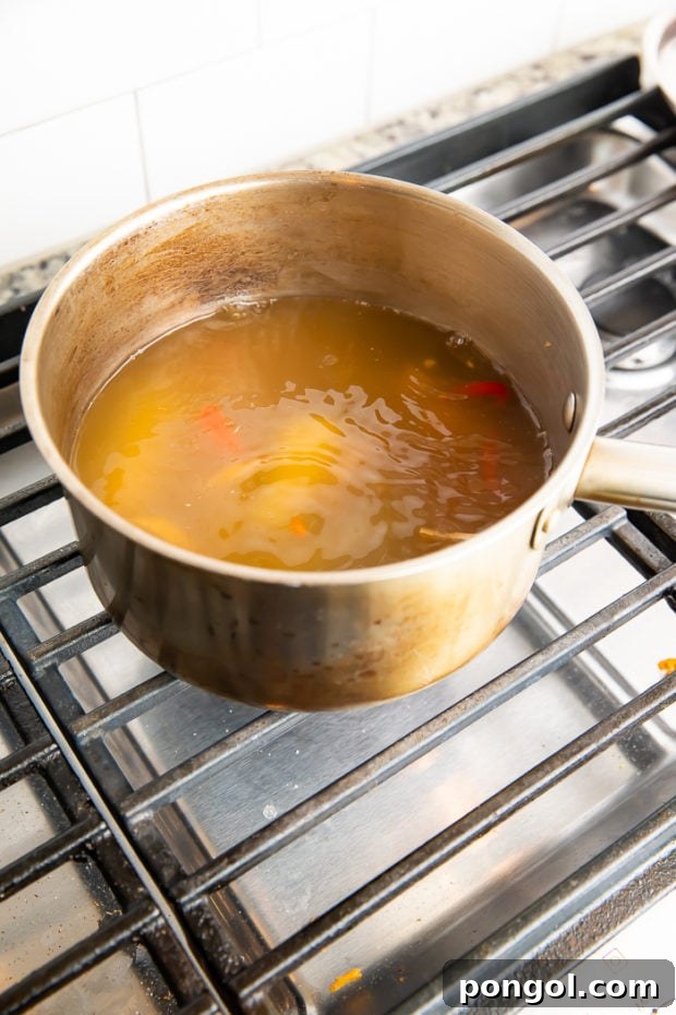 Step 1: Simmer aromatics in chicken stock with palm sugar and fish sauce.
