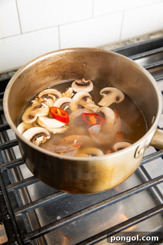 Step 2: Add sliced mushrooms and simmer.